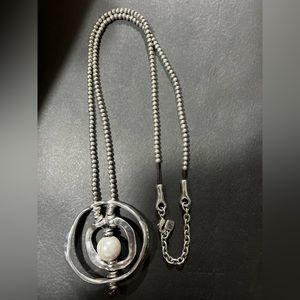 UNO de 50 necklace 19” long with 2” wide pendant with pearl